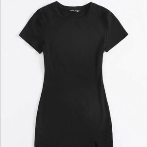 Black mini dress with a slit.